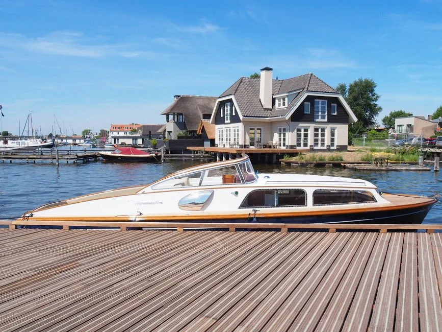 Trusted Experts in Professional Motor Yacht Restoration - Boat by Dock